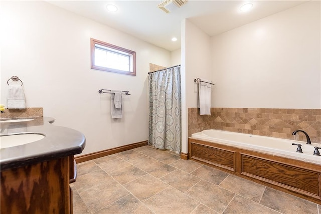 bathroom with vanity and separate shower and tub