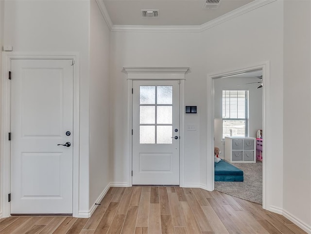 1718 Zayden Ln, Norman, OK 73072 - entryway featuring light hardwood / wood-style floors, crown molding, ceiling fan, and a healthy amount of sunlight
