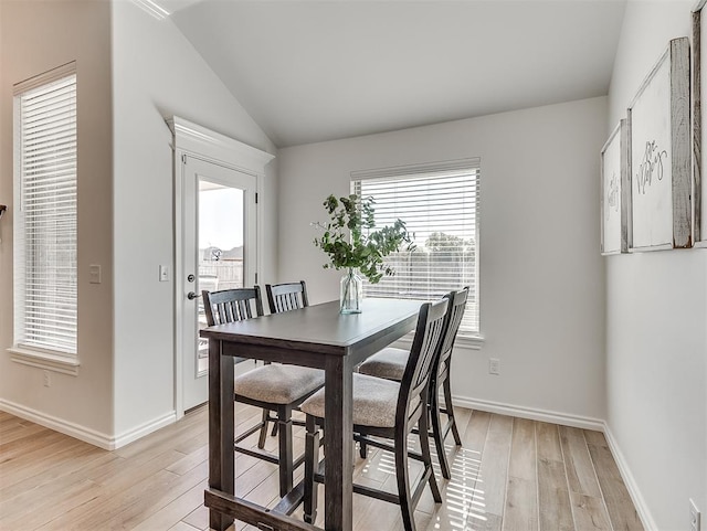 1718 Zayden Ln, Norman, OK 73072 - dining area with light hardwood / wood-style flooring and vaulted ceiling