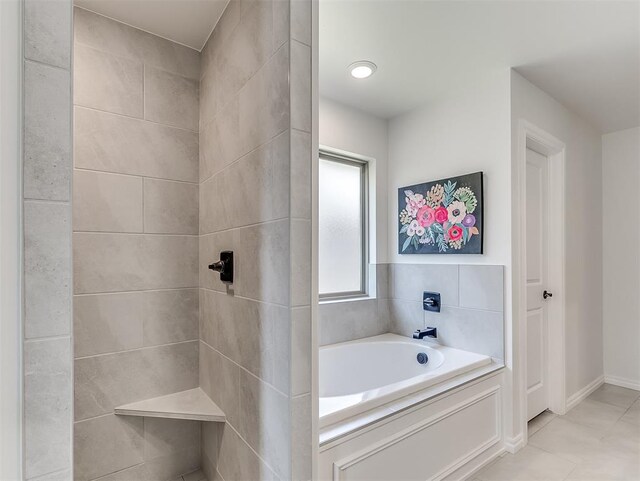 1718 Zayden Ln, Norman, OK 73072 - bathroom featuring a tub to relax in and tile patterned flooring