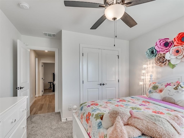 1718 Zayden Ln, Norman, OK 73072 - bedroom featuring light colored carpet, a closet, and ceiling fan