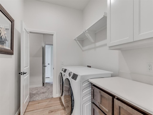 1718 Zayden Ln, Norman, OK 73072 - laundry room featuring washer and dryer, cabinets, and light wood-type flooring