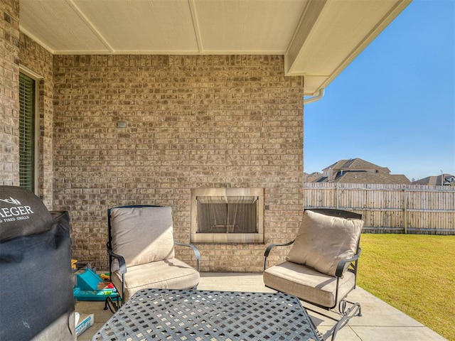 1718 Zayden Ln, Norman, OK 73072 - view of patio featuring a large fireplace
