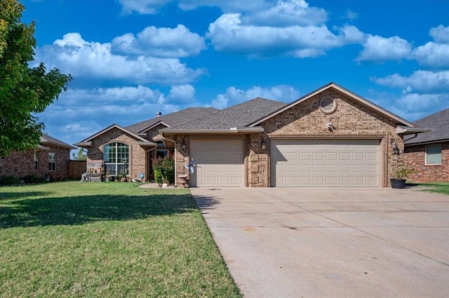 ranch-style house with a garage and a front yard