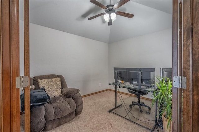 home office featuring carpet flooring, ceiling fan, and vaulted ceiling