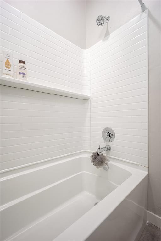 bathroom featuring  shower combination