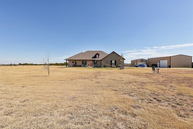 view of front of home featuring a garage and an outdoor structure