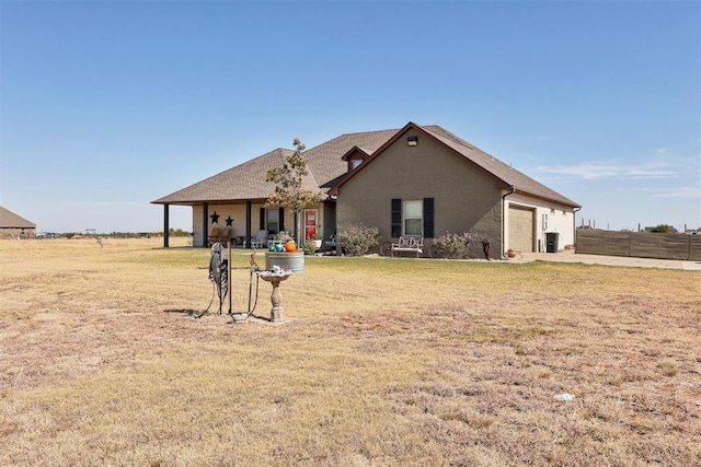 view of front facade featuring a garage and a front lawn