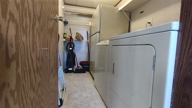 washroom with washing machine and clothes dryer