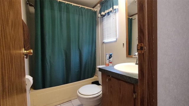 full bathroom with tile patterned flooring, shower / bath combo, vanity, and toilet