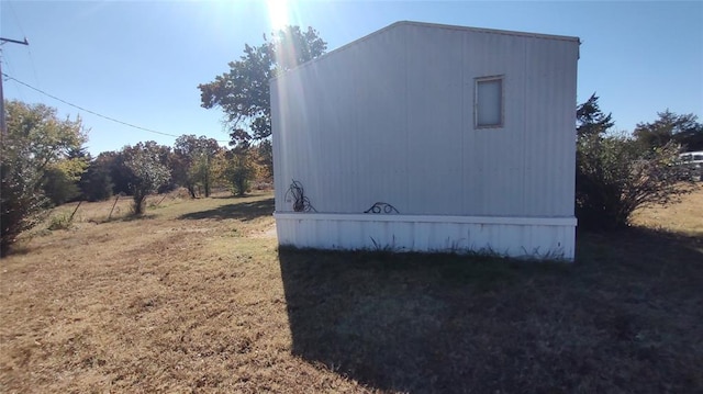 view of home's exterior with a yard