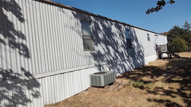 view of side of property featuring central AC unit