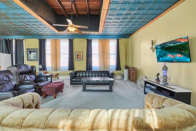 carpeted living room with ceiling fan