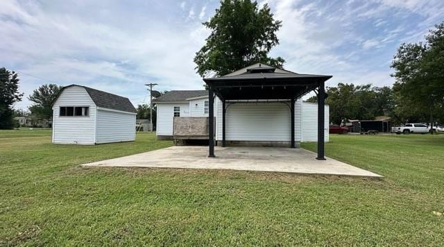 rear view of property with a shed and a yard