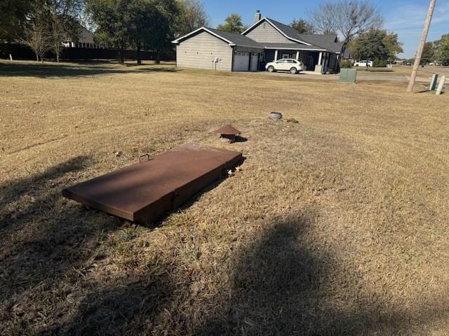 view of storm shelter featuring a yard