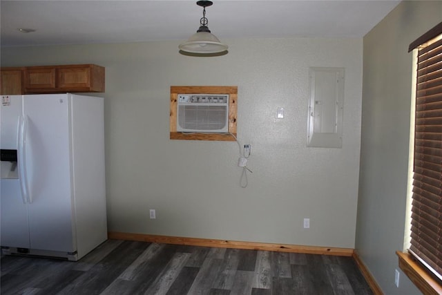 kitchen featuring a wall mounted air conditioner, electric panel, dark hardwood / wood-style floors, white fridge with ice dispenser, and decorative light fixtures