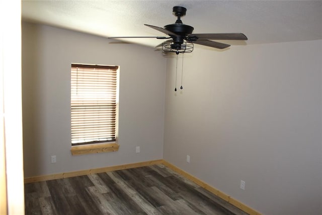 unfurnished room featuring dark hardwood / wood-style flooring and ceiling fan