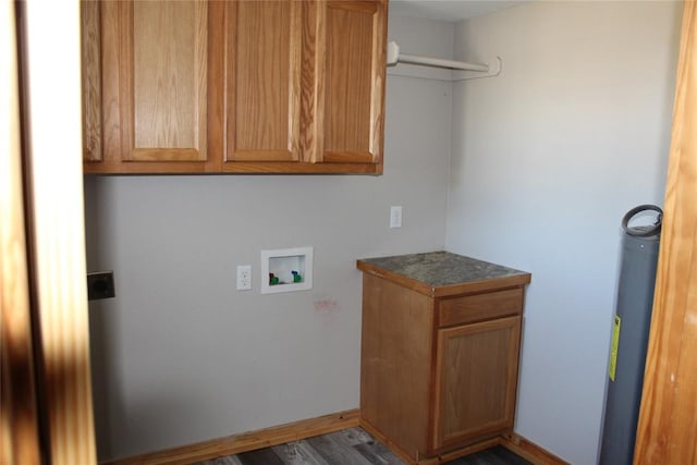 laundry room featuring cabinets, washer hookup, and dark hardwood / wood-style flooring