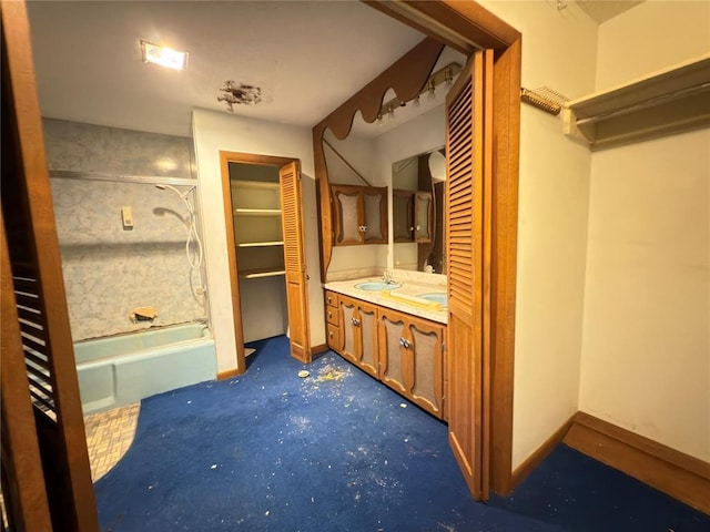 bathroom featuring vanity and independent shower and bath