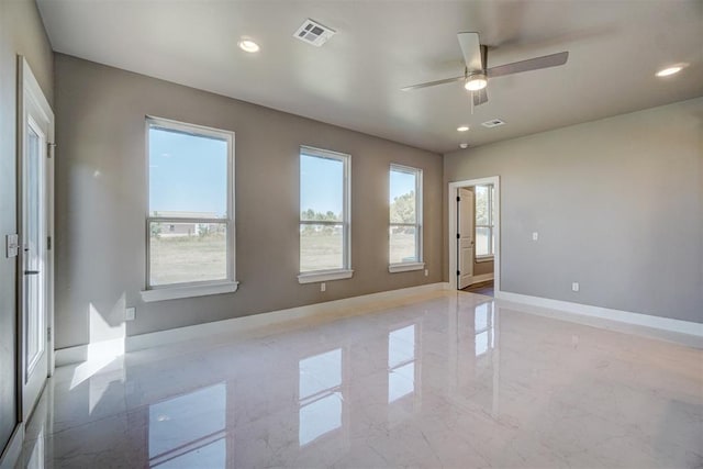 spare room with ceiling fan