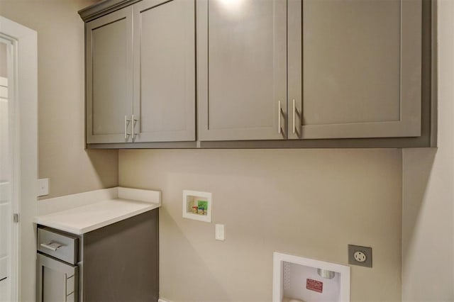 laundry area with electric dryer hookup, cabinets, and hookup for a washing machine