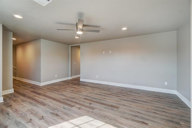 empty room with light hardwood / wood-style floors and ceiling fan