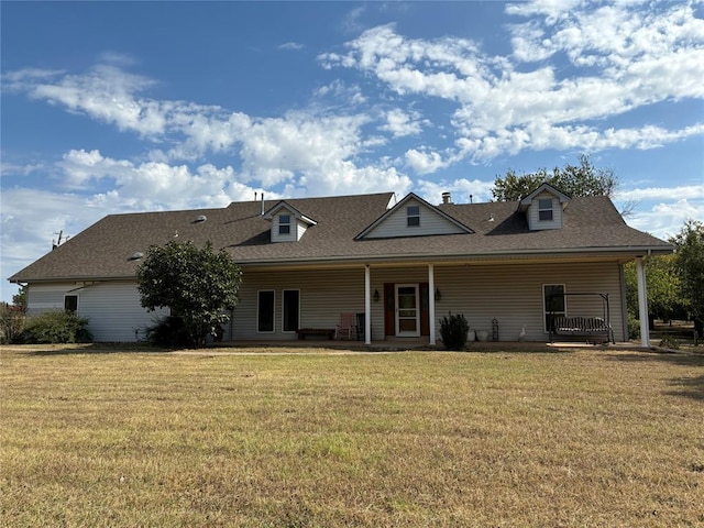 back of house featuring a lawn