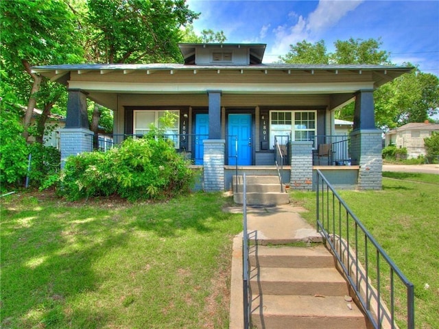 1801 NW 8th St, Oklahoma City, OK 73106 - view of front facade featuring a porch and a front yard