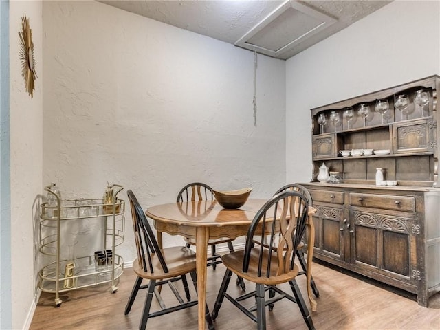 dining area with light wood-type flooring