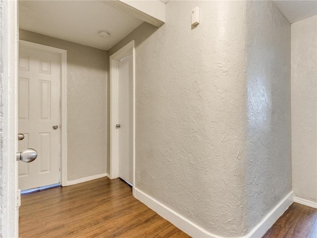 hallway featuring hardwood / wood-style floors