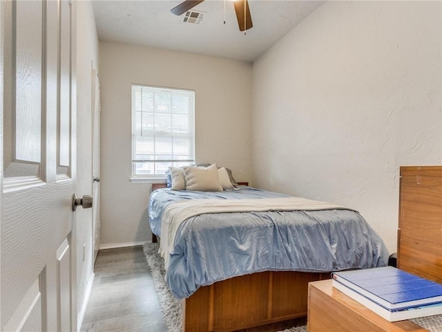 bedroom featuring wood-type flooring and ceiling fan