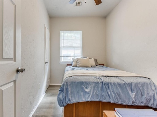 bedroom featuring ceiling fan and light hardwood / wood-style floors