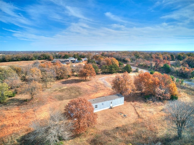 birds eye view of property with a rural view