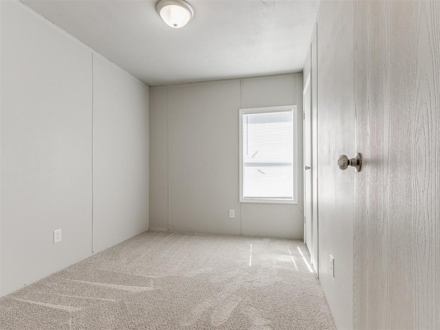 unfurnished room with carpet flooring