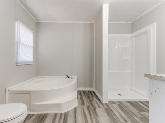 full bathroom featuring crown molding, toilet, and hardwood / wood-style flooring