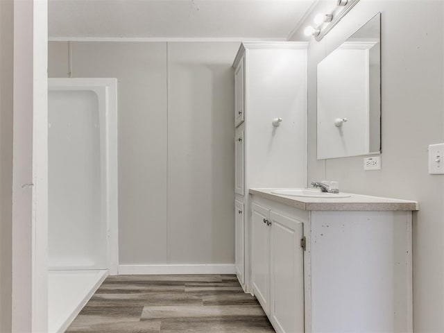 bathroom featuring hardwood / wood-style floors and vanity