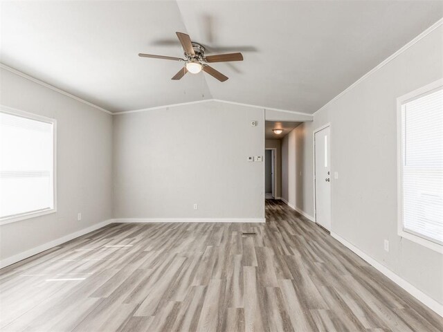 unfurnished room featuring light wood-type flooring, a wealth of natural light, and ceiling fan