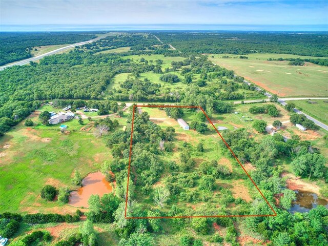 drone / aerial view with a rural view and a water view