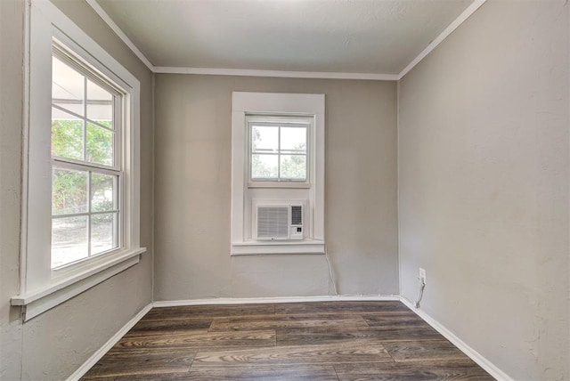 unfurnished room with crown molding, cooling unit, and dark hardwood / wood-style floors