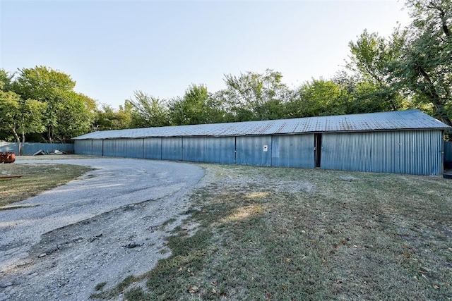 view of outdoor structure featuring a yard