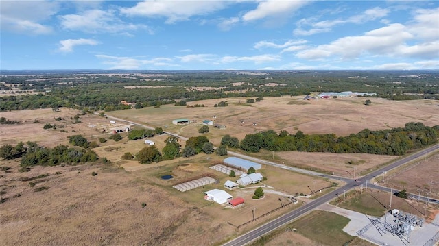 birds eye view of property featuring a rural view