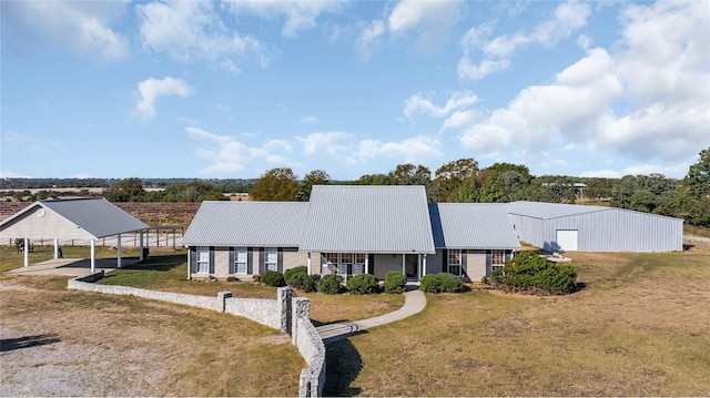 view of front of house with a front lawn and a carport