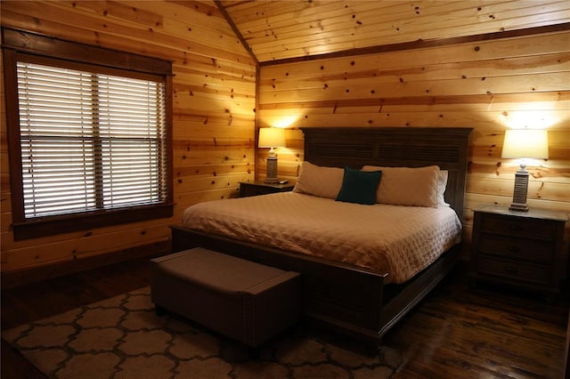 bedroom with dark hardwood / wood-style flooring, vaulted ceiling, and wood walls