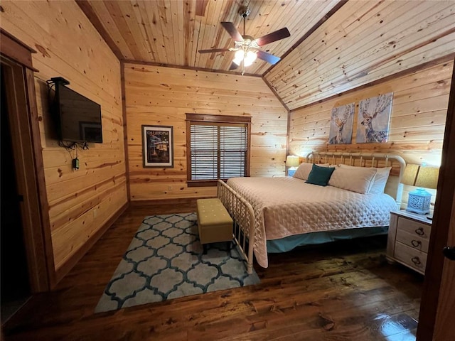 bedroom featuring dark hardwood / wood-style floors, wooden ceiling, wooden walls, and vaulted ceiling