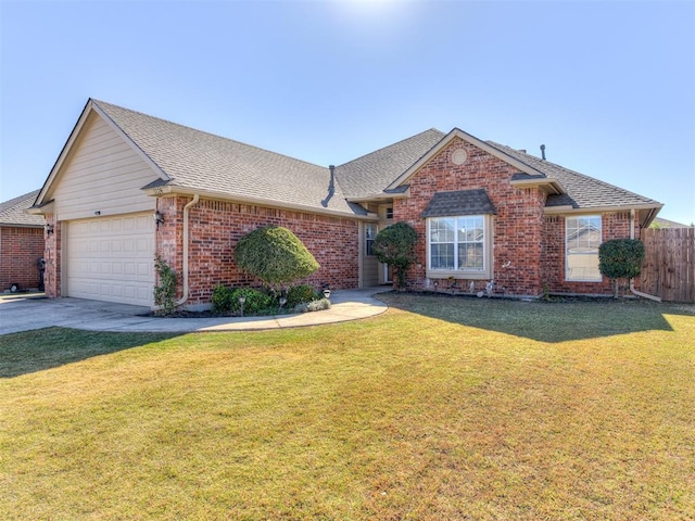 ranch-style house with a front yard and a garage