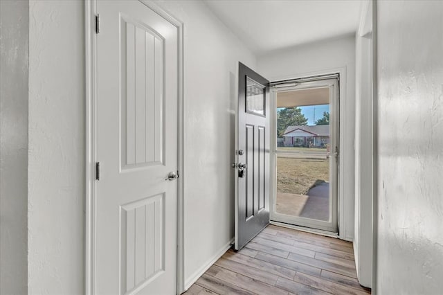 doorway with light hardwood / wood-style floors