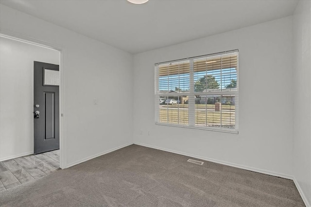 unfurnished room with carpet floors