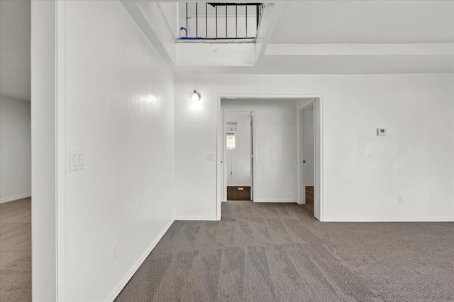 spare room featuring light colored carpet