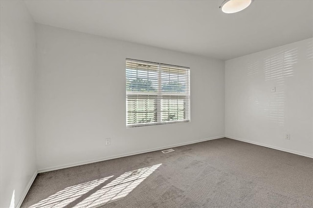 unfurnished room featuring carpet floors