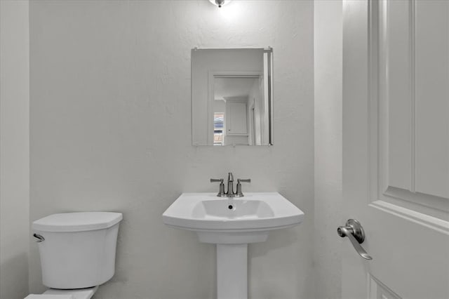 bathroom with sink and toilet